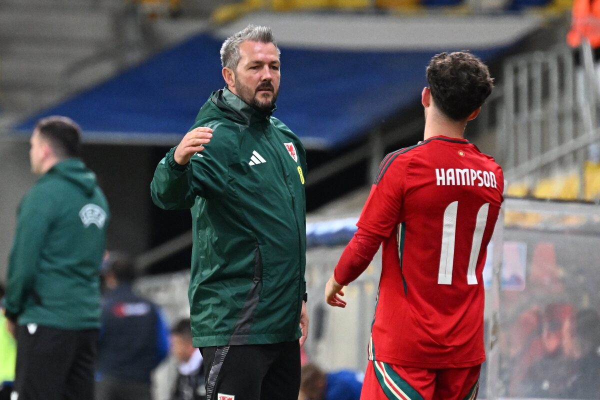 Owen Hampson receiving coaching feedback with Wales Under-21s
