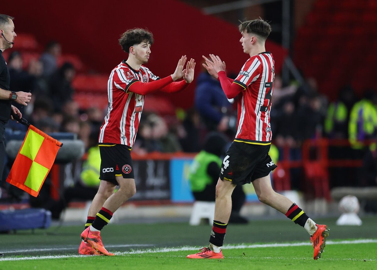 Owen Hampson with a Sheffield United teammate at Old Trafford